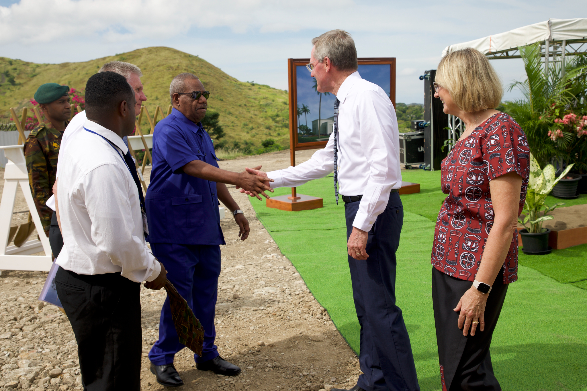 Elder-and-Sister-Meurs-greet-H.E.-Sir-Bob-Dadae,-Governor-General-of-Papua-New-Guinea,-at-Port-Moresby-Temple-groundbreaking-22-April-2023.jpg