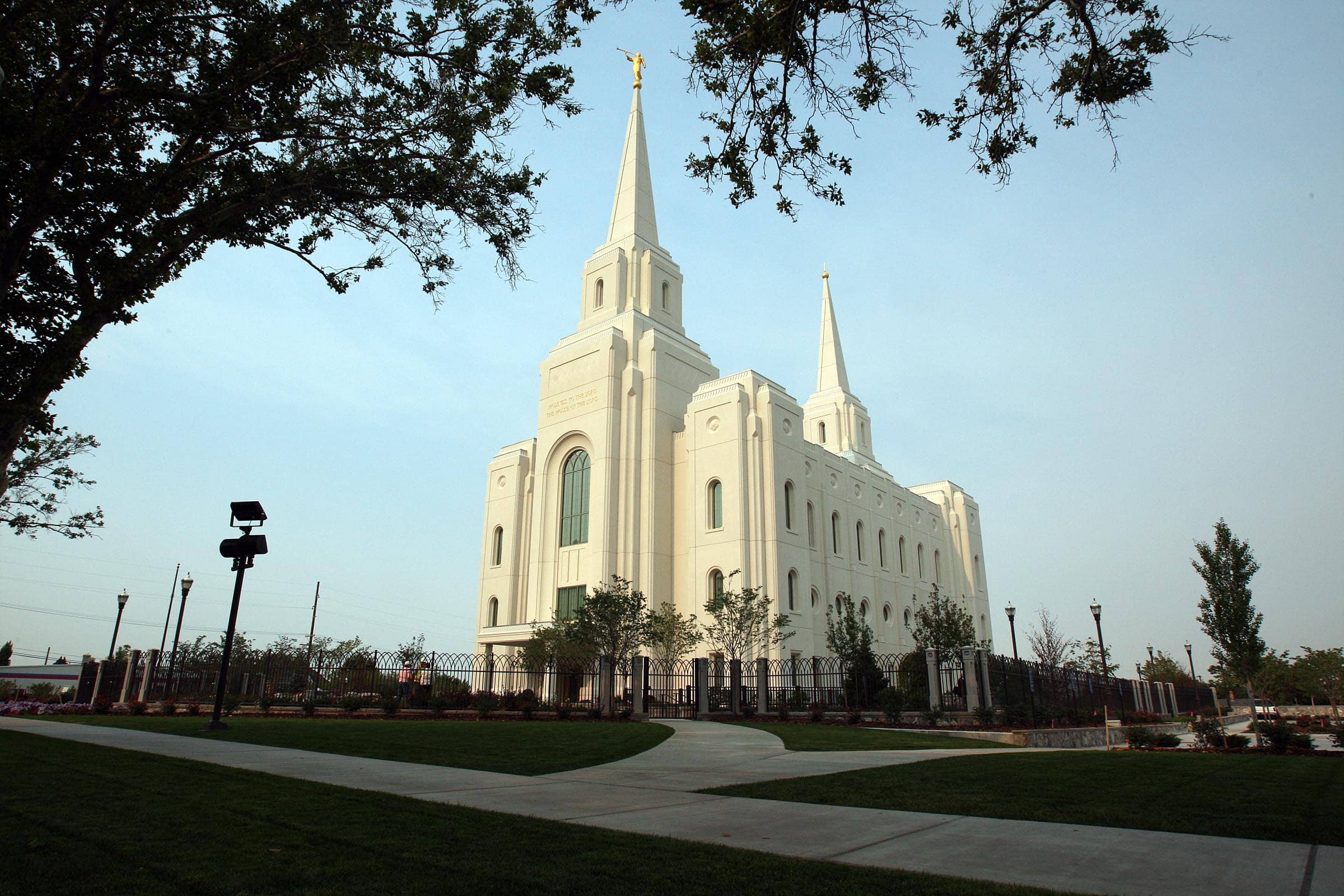 The Brigham City Utah Temple, a white building with spires at each end.