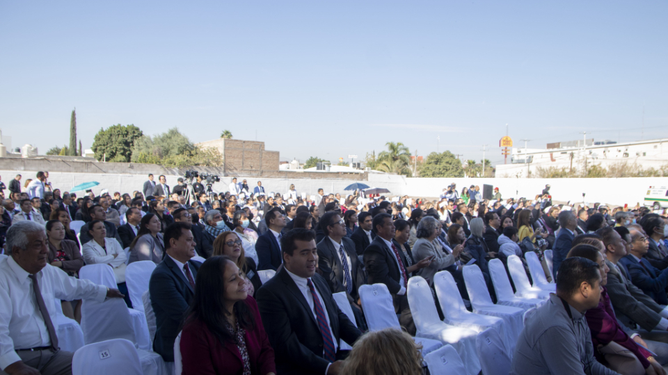 A crowd of people sitting outside on white chairs at the Torreón Mexico Temple groundbreaking ceremony.