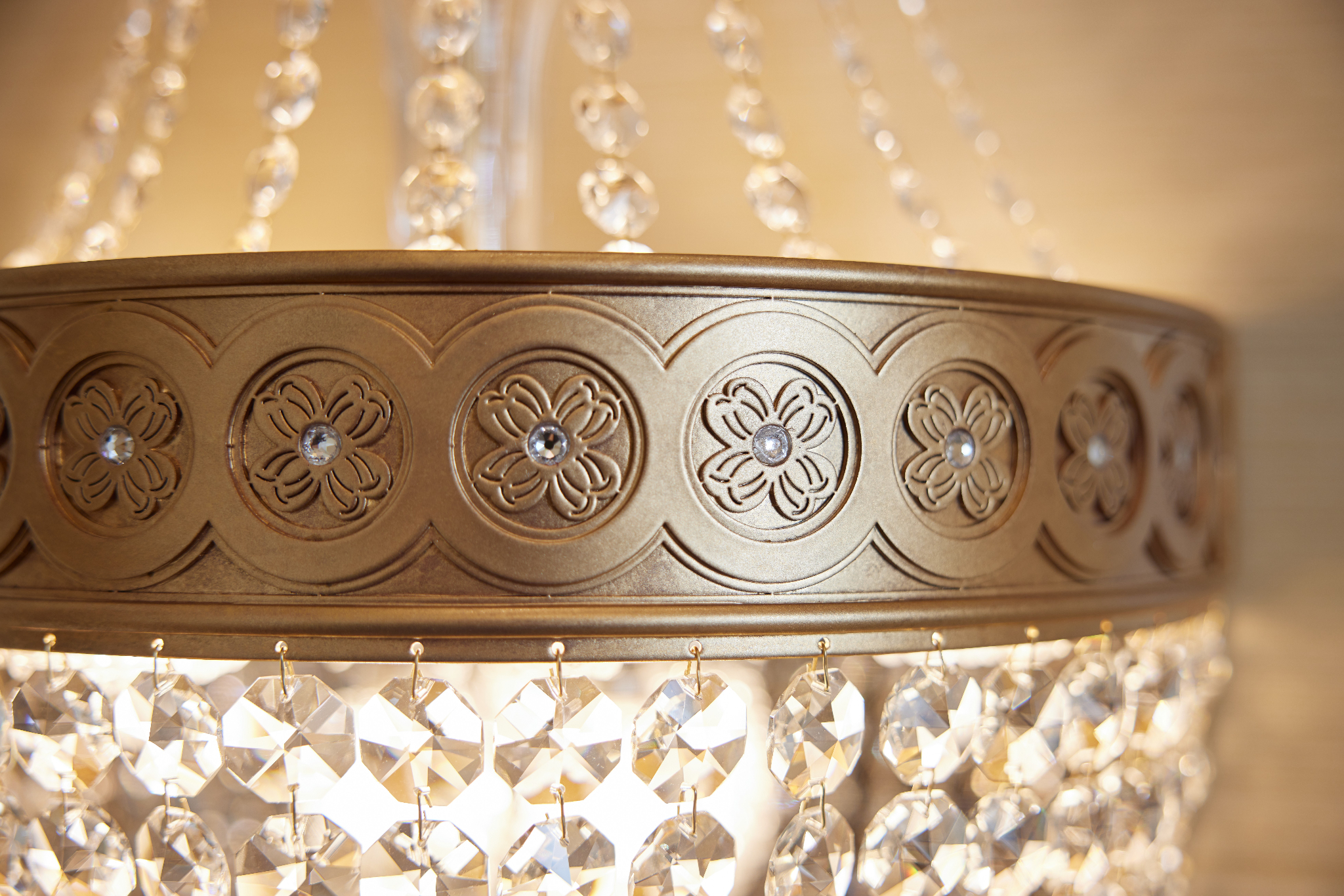 A close-up of a chandelier with a flower pattern.