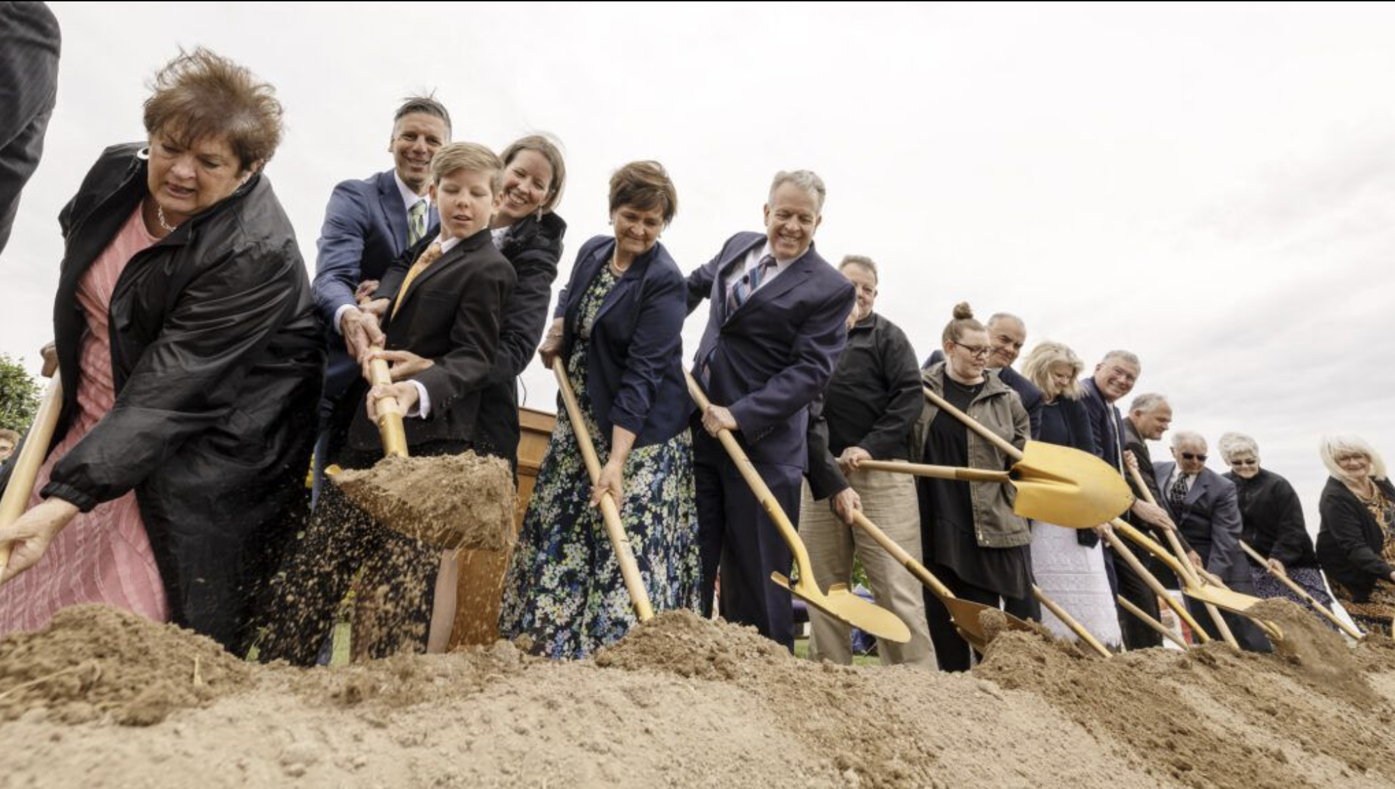 Elder Brent H. Nielson of the Seventy of The Church of Jesus Christ of Latter-day Saints, and his wife, Sister Marcia Nielson, are joined by others in turning over soil as Burley, Idaho, and surrounding-area residents gather to take part in the groundbreaking of the Burley Idaho Temple of The Church of Jesus Christ of Latter-day Saints.