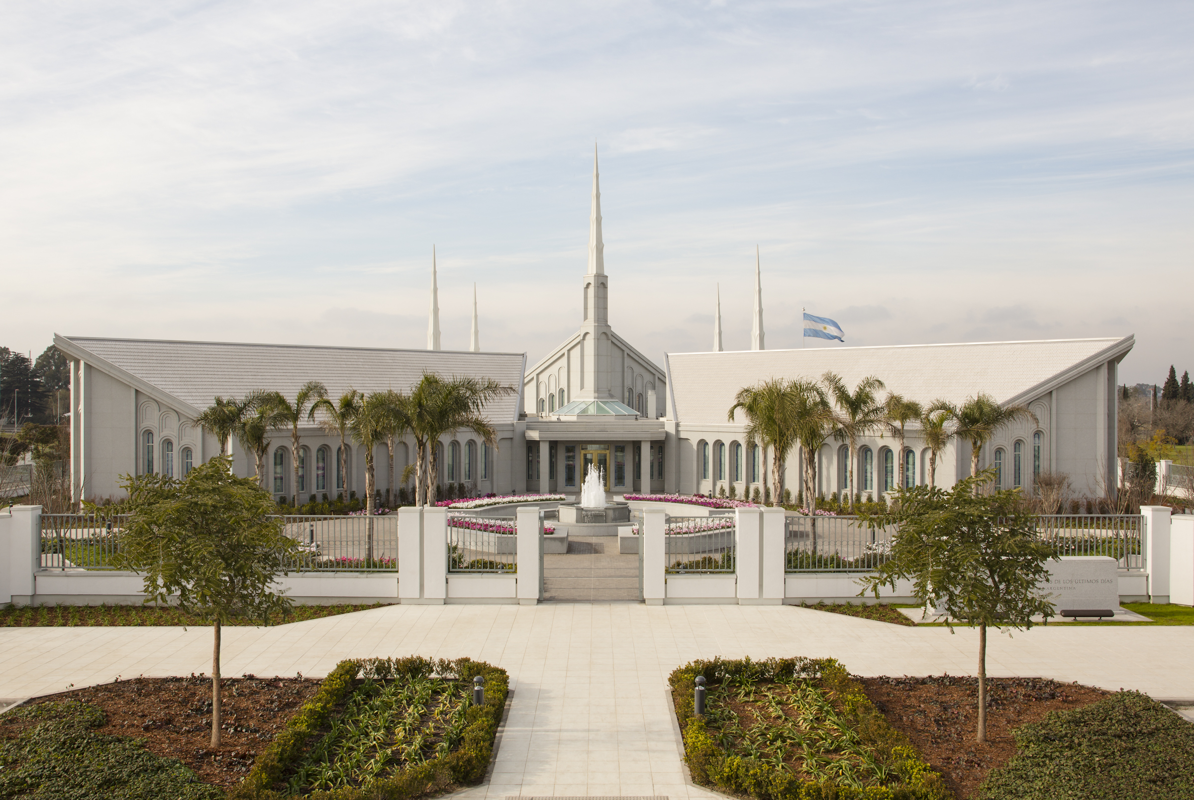 The Buenos Aires Argentina Temple, a gray building with a peaked roof on top and six tall spires around it.