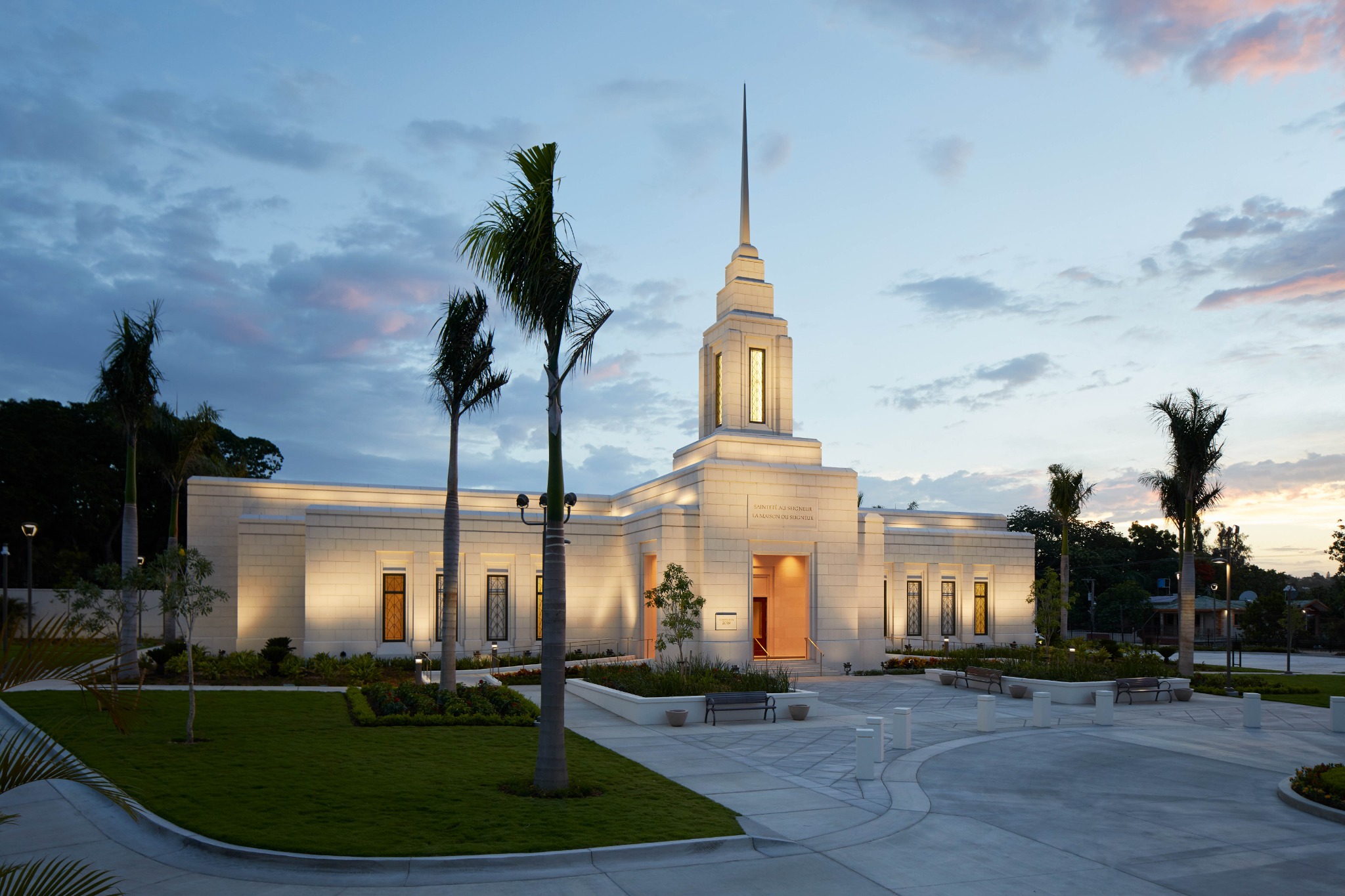 The Port-au-Prince Haiti Temple, a white building surrounded by tropical trees.