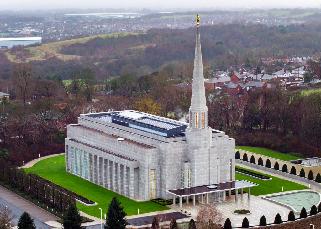 The Preston England Temple, a rectangular building with a spire above one side.