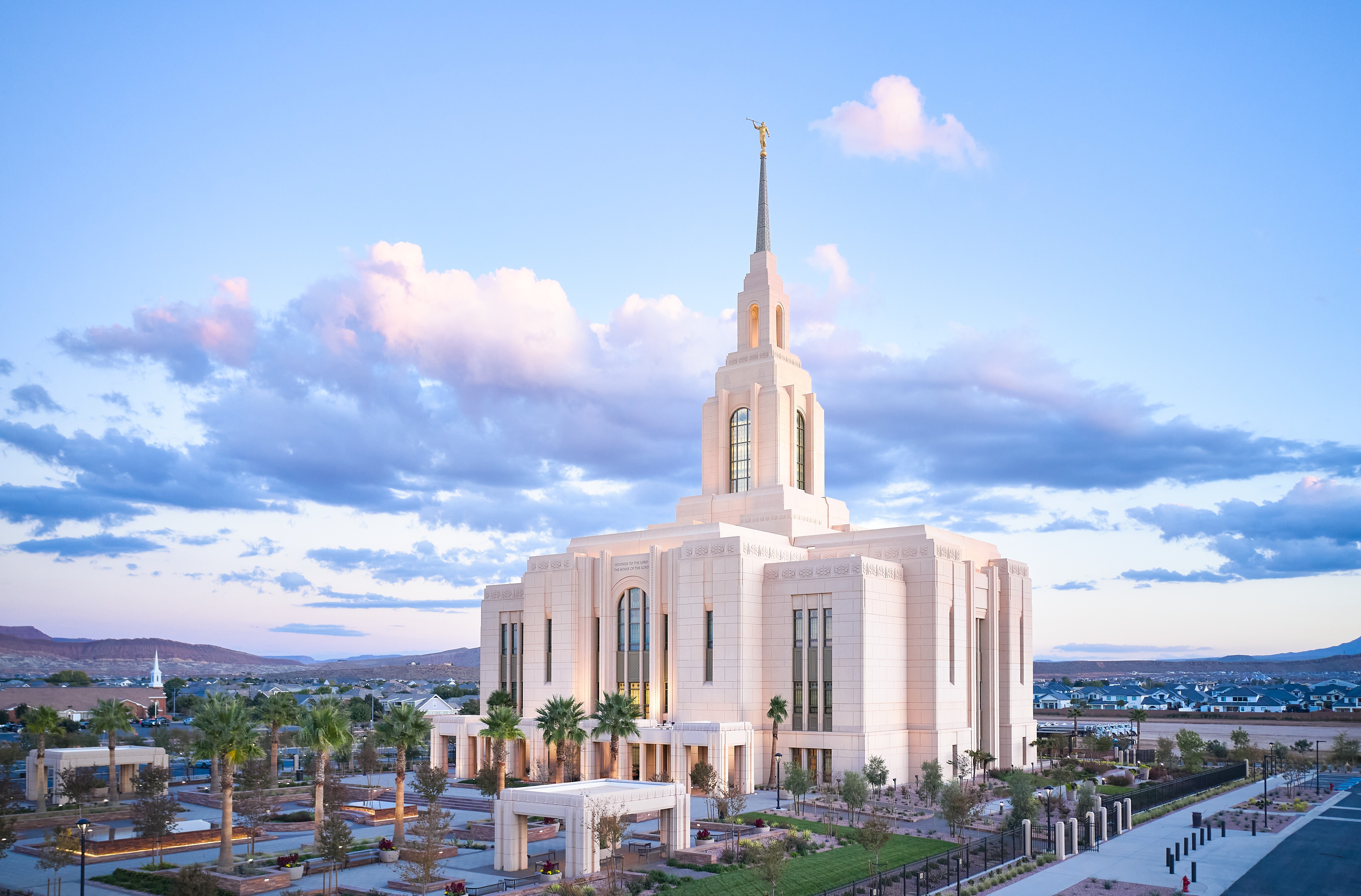 The exterior of the Red Cliffs Utah Temple, a rectangular building with arched windows and a center tower and spire.