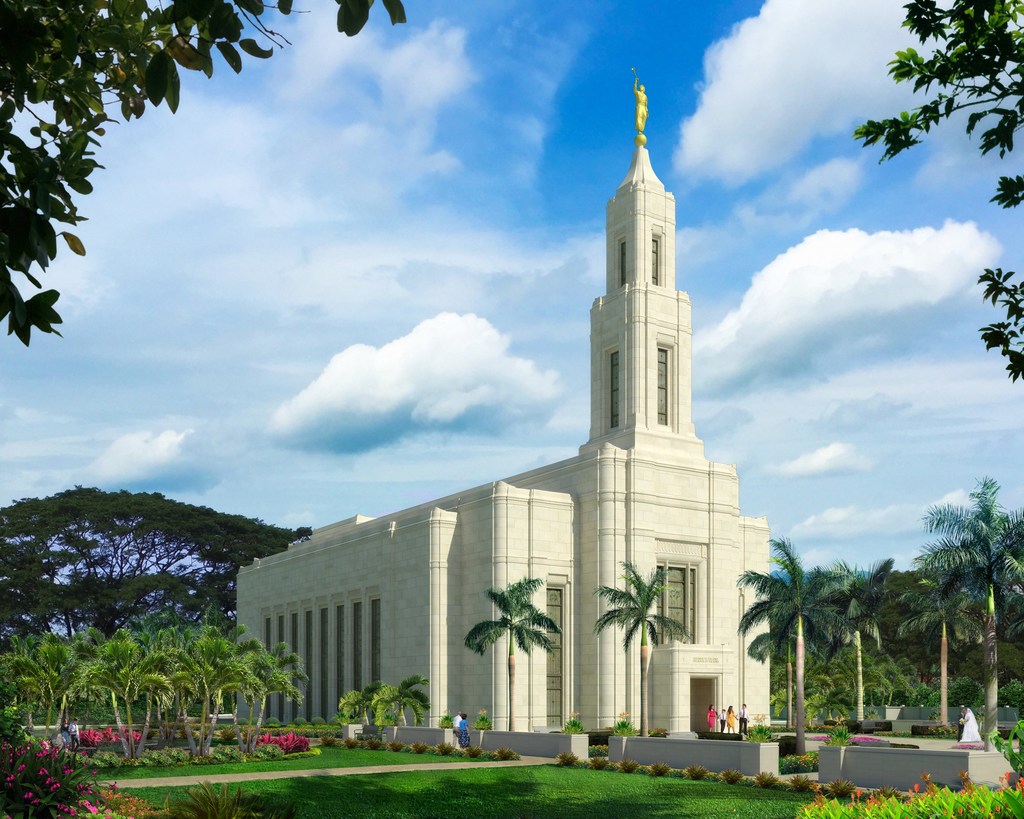 An exterior rendering of the Urdaneta Philippines Temple, with a spire on top and palm trees surrounding it.
