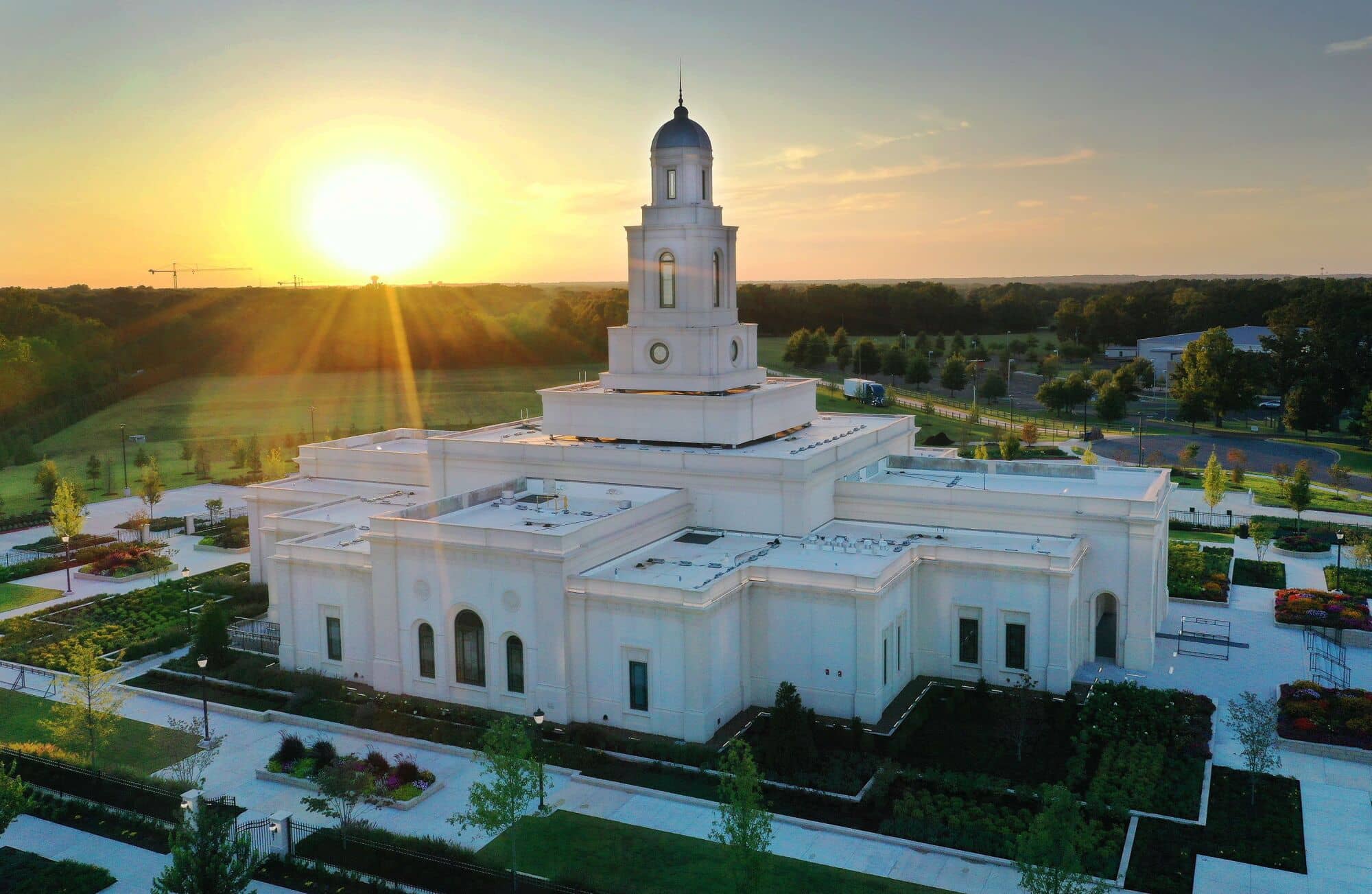 The Bentonville Arkansas Temple, a white one-story building with a center spire.