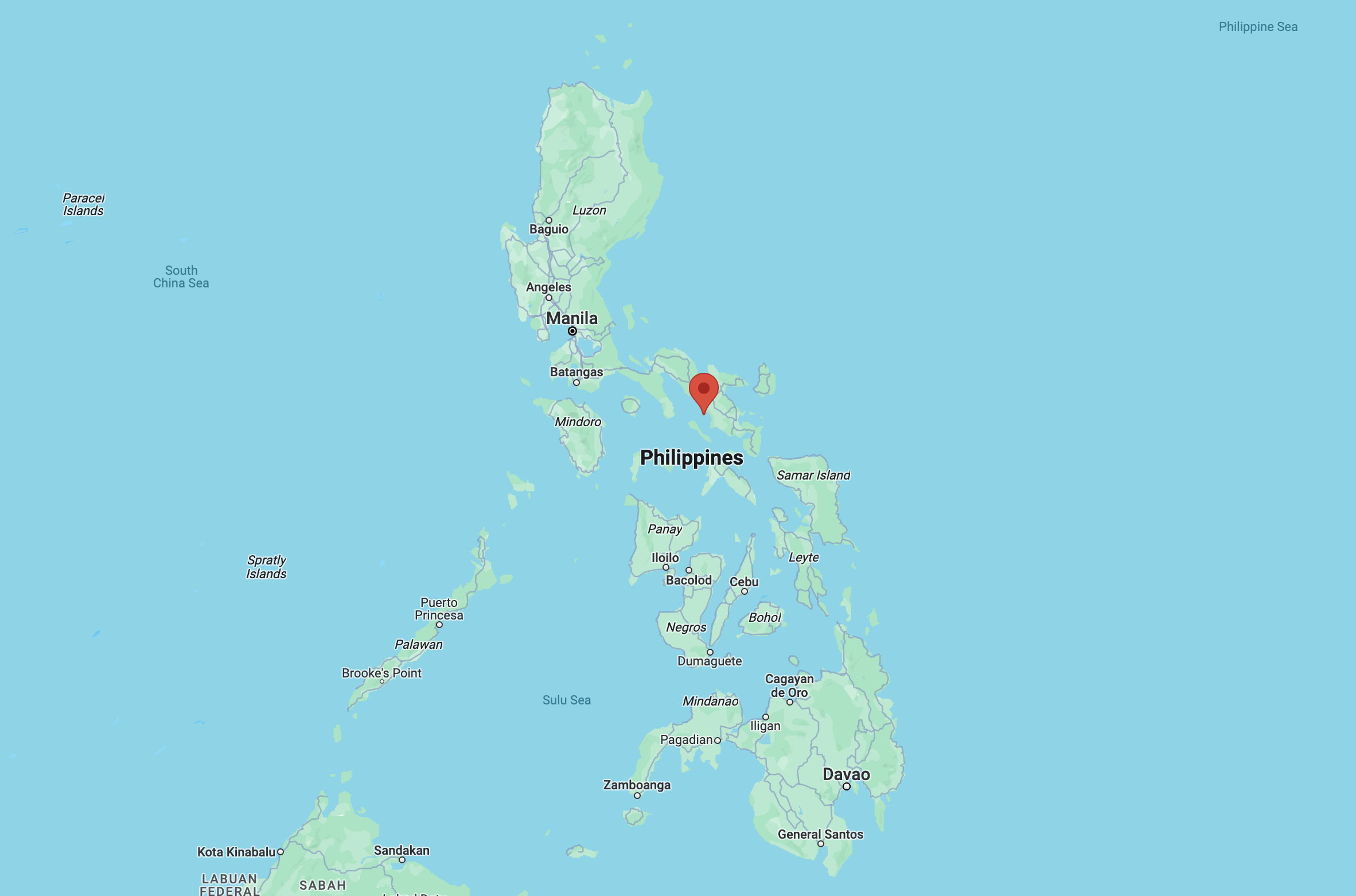 A map of the Philippines, with a pin in Naga, in the center of the country.
