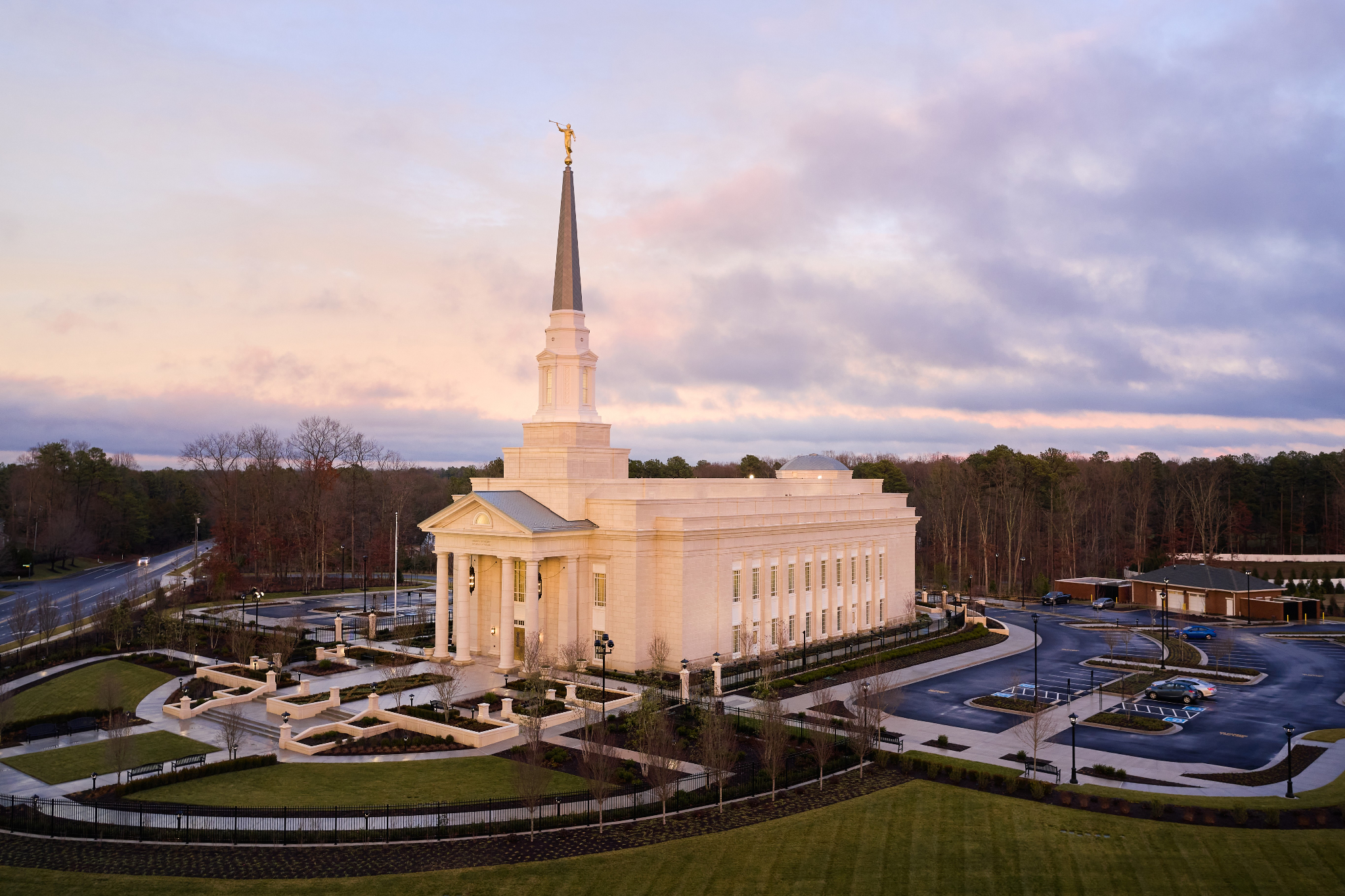 The Richmond Virginia Temple, a two-story rectangular building with a tall spire in the front center.